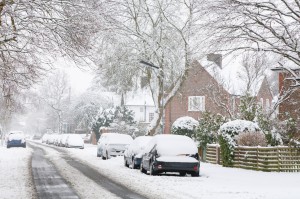 a_street_lines_with_cars_during_a_snow_storm