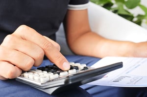 http://www.dreamstime.com/royalty-free-stock-photos-young-man-checking-bill-budget-payroll-closeup-calculator-image45213218